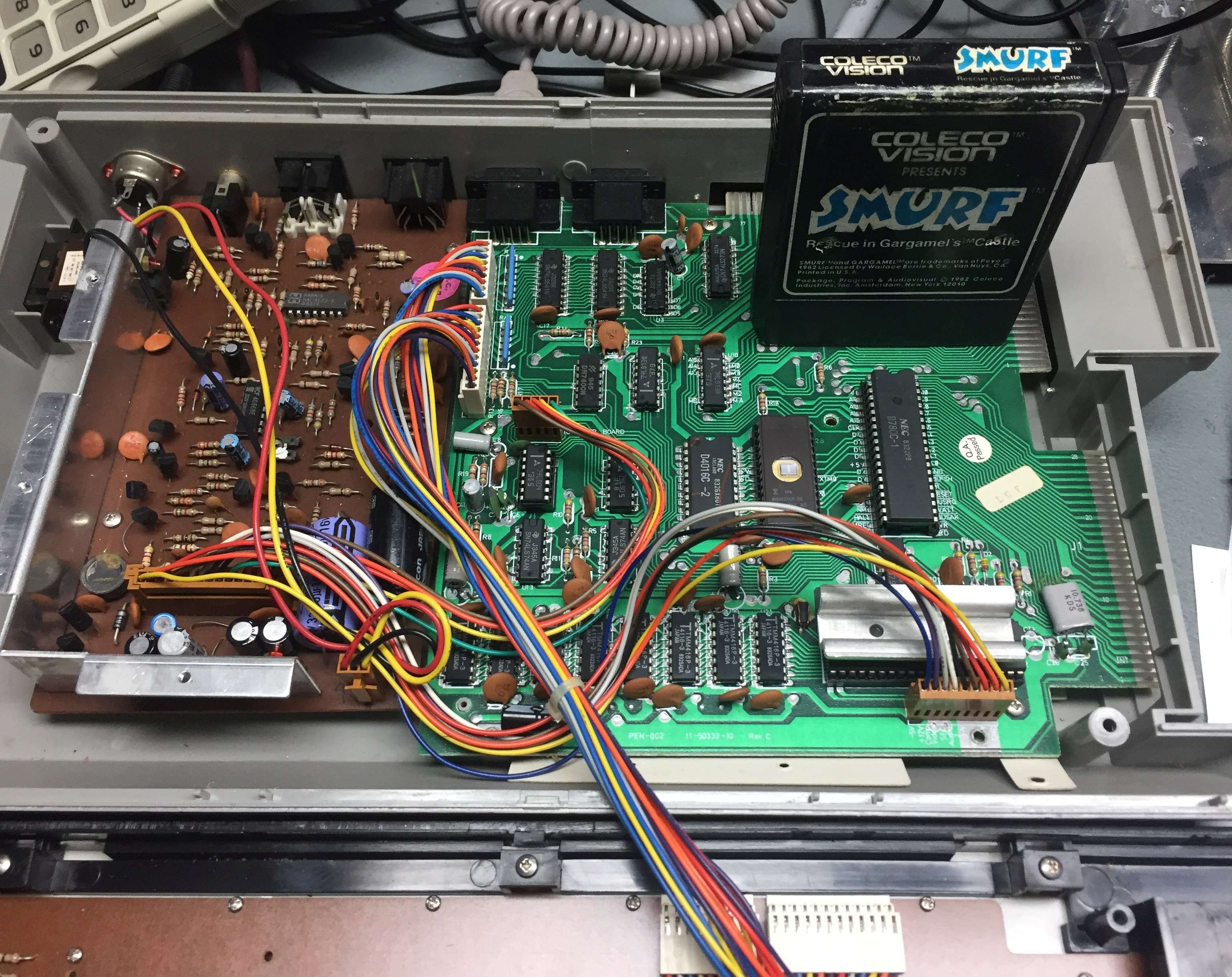 Pencil II opened with ColecoVision Smurf cartridge inserted