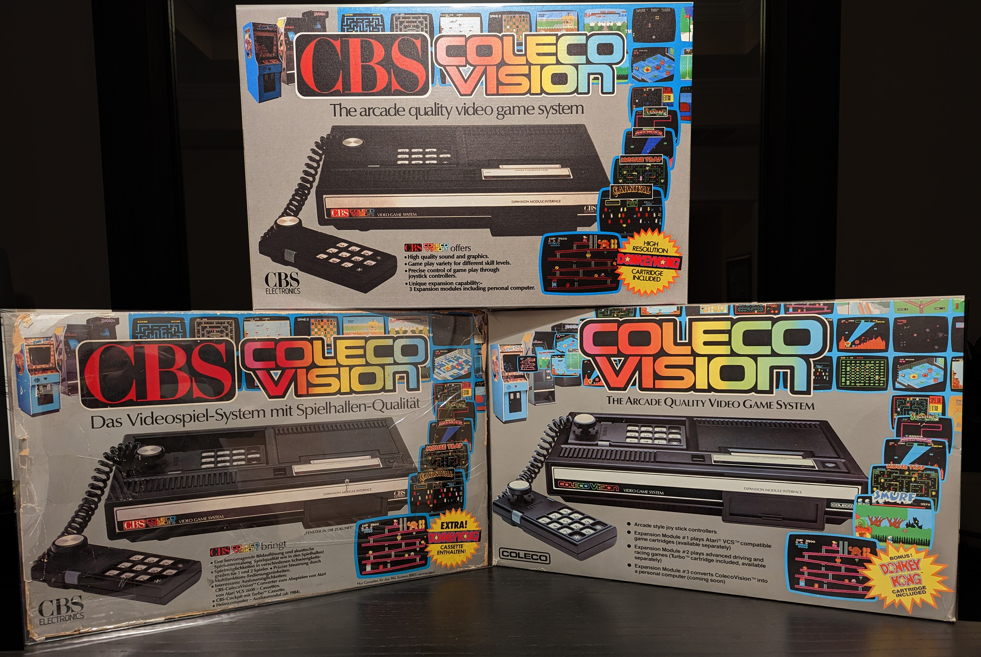 Three ColecoVision console models showing different regional variants